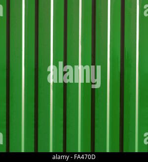 Diagonal pattern of metal profile. Fences from the galvanized iron painted by a polymeric covering. Stock Photo