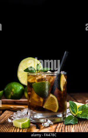 Fresh made Cuba Libre with brown rum and tasty lime Stock Photo