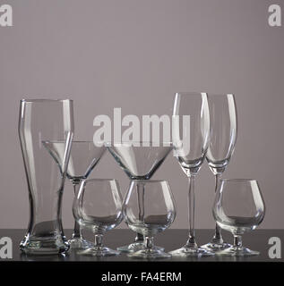 set of different glasses for alcoholic drinks on dark background Stock Photo