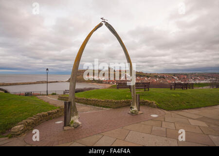 View of the harbour,abbey and east cliffs of Whitby,North Yorkshire,England and featuring the whale bone arch in foreground Stock Photo