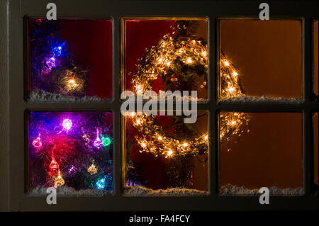 Christmas tree through home window Stock Photo - Alamy