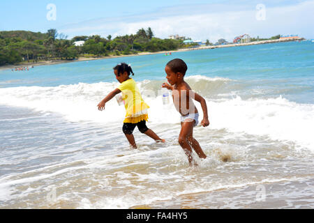 Bahamian girl playing on beach on New Providence Island in Bahamas ...