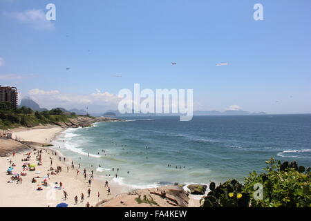 Rio de Janeiro, Brazil, 20th December, 2015: With heat in the range of 30-35 degrees Celsius, locals and tourists crowded the beaches of the south of the city and enjoyed the sea clear and clean waters and took advantage of the sunny Sunday. Copacabana, Ipanema, Leblon and Arpoador are the preferred beaches. Stock Photo