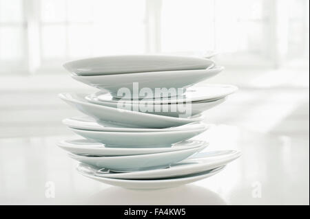 Close-up of stack of white plates, Bavaria, Germany Stock Photo
