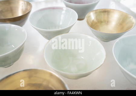 Close-up of porcelain bowls on glass table, Bavaria, Germany Stock Photo