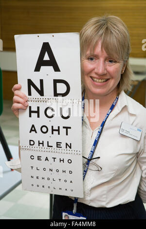 School nurse carrying out eyesight test, Stock Photo