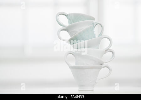 Close-up of stack of white cups, Bavaria, Germany Stock Photo