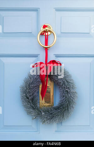 Christmas wreath on a pale blue wooden door Stock Photo