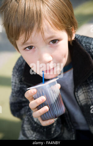 Child drinking from juice carton, Stock Photo