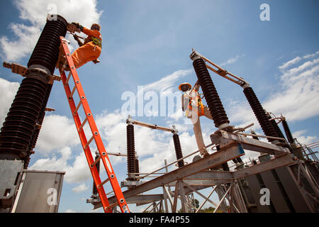 Electrical engineers assist in the construction of a new electrical substation in Tanga, Tanzania. Stock Photo