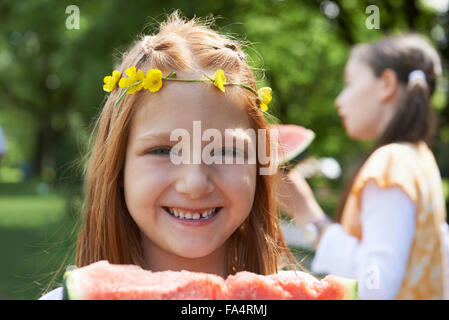 Girls enjoying slices of watermelon at picnic, Munich, Bavaria, Germany Stock Photo