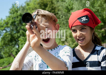 Children playing pirate game in adventure playground, Bavaria, Germany Stock Photo