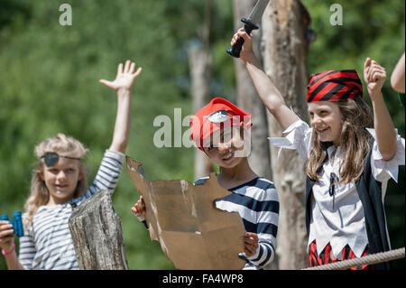 Girls playing on pirate ship in adventure playground, Bavaria, Germany Stock Photo