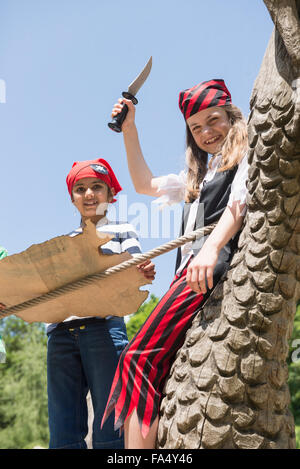 Two girls standing on pirate ship in a adventure playground, Bavaria, Germany Stock Photo