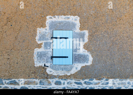 Closed light blue shutter of French farmhouse in Normandy Stock Photo
