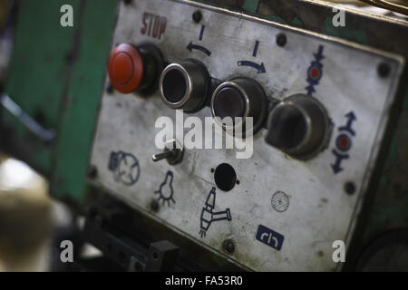 Color image of some buttons on a dirty old control panel. Stock Photo