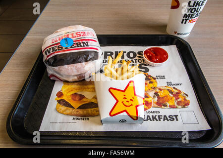 A Carls Jr. meal with hamburger, fries, and a drink Stock Photo