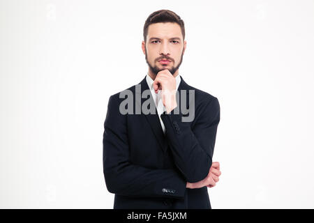 Portrait of a pensive businessman looking at camera isolated on a white background Stock Photo