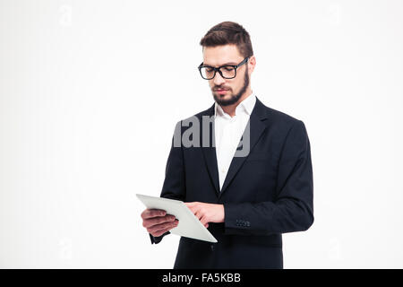 Portrait of a handsome businessman using tablet computer isolated on a white background Stock Photo
