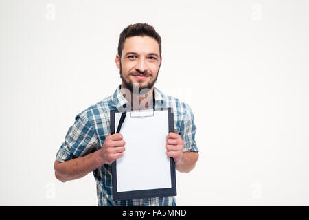 Happy smiling bearded man in checkered shirt holding blank clipboard over white background Stock Photo