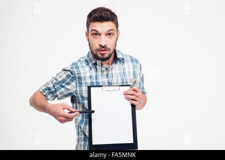 Serious handsome bearded man in plaid shirt pointing on blank clipboard over white background Stock Photo