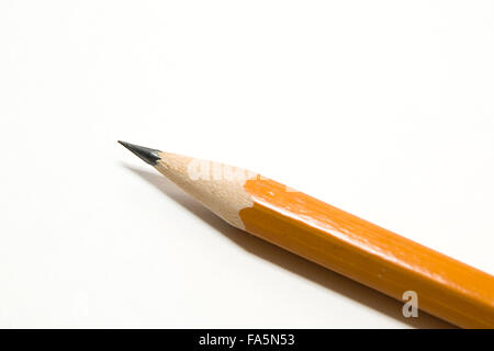 Orange wooden pencil for writing on over white Stock Photo