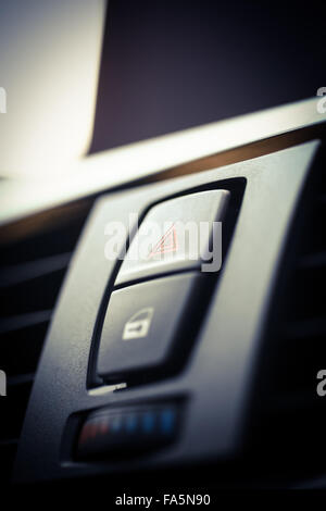 Detail of a warning button in a car. Stock Photo