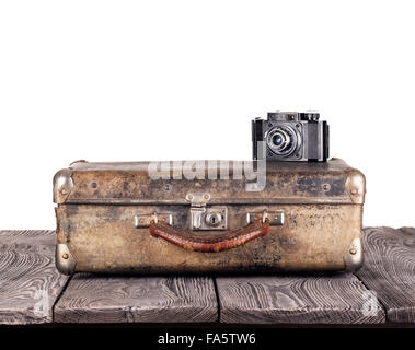 Old suitcase with camera isolated on white background Stock Photo