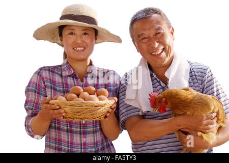 The farmer took the chicken and the egg Stock Photo