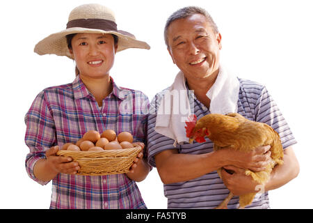 The farmer took the chicken and the egg Stock Photo