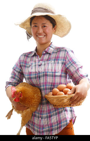 The farmer took the chicken and the egg Stock Photo