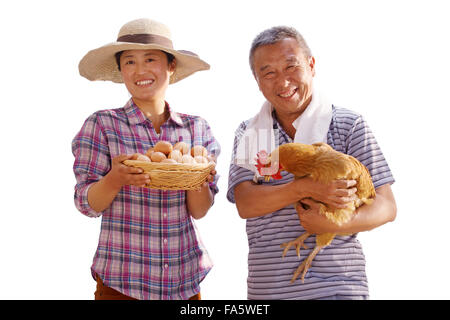 The farmer took the chicken and the egg Stock Photo