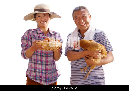 The farmer took the chicken and the egg Stock Photo