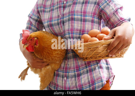 The farmer took the chicken and the egg Stock Photo