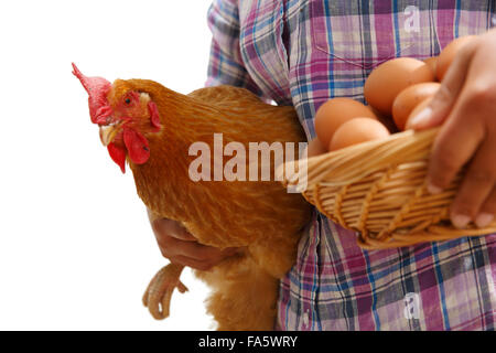 The farmer took the chicken and the egg Stock Photo