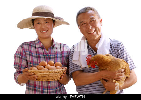 The farmer took the chicken and the egg Stock Photo