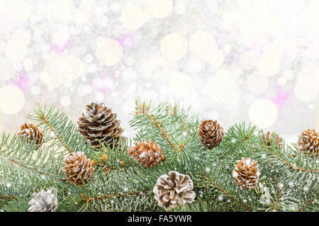 Festive Christmas background with ornaments and fir tree branch Stock Photo