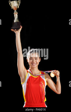 Women athletes win medals and trophies Stock Photo