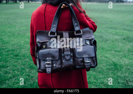 Woman in red overcoat holding a Mulberry Roxanne leather handbag Stock  Photo - Alamy