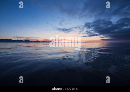 Dawn over calm sea near Tasiilaq, east Greenland Stock Photo