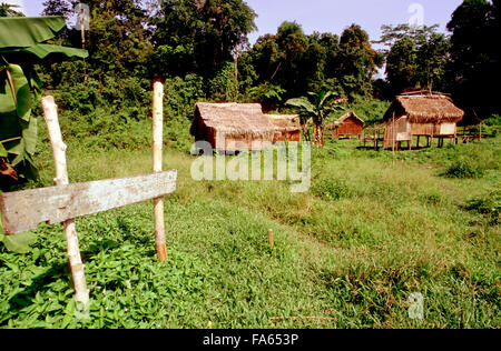 Orang Asli tribe in Taman Negara National Park in central Malaysia. Typical hutsin the village. Stock Photo