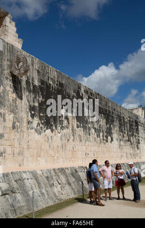 Tourists with Guide, The Grand Ball Courrt (Gran Juego de Pelota), Chichen Itza, UNESCO World Heritage Site, Yucatan, Mexico Stock Photo