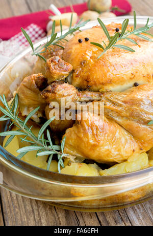 Roast chicken stuffed with potatoes and aromas Stock Photo
