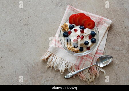 Overhead view of Yogurt parfait with granola and fresh berries Stock Photo