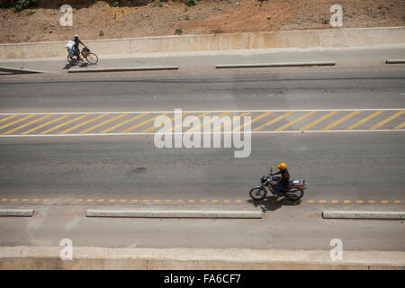 Traffic moves along the newly rehabilitated Tanga – Horohoro trunk road in Northeastern Tanzania. Stock Photo