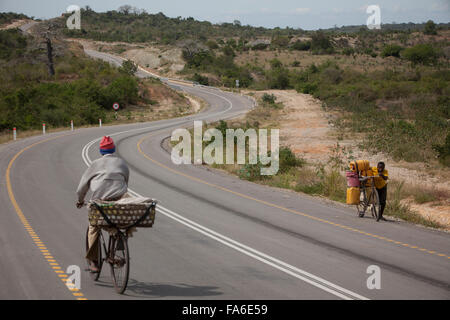 Traffic moves along the newly rehabilitated Tanga – Horohoro trunk road in Northeastern Tanzania. Stock Photo