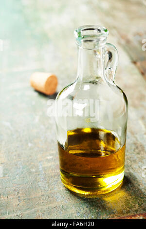 Extra virgin healthy Olive oil on rustic wooden background Stock Photo