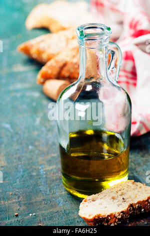 Italian Bread with Olive Oil for Dipping on wooden rustic table Stock Photo