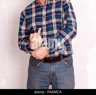 Mature man in handcuffs, focus is on his hands. Stock Photo