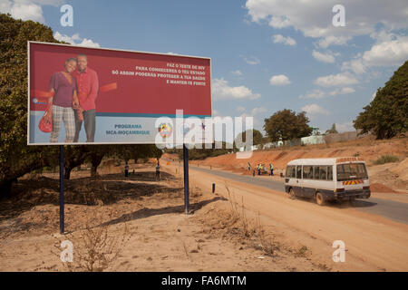 An HIV-awareness billboard stands along the Nampula to Rio Ligonha Road in Northern Mozambique - SE Africa. Stock Photo